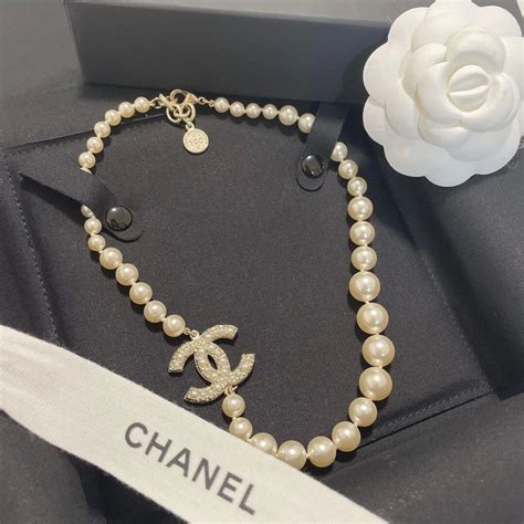 chanel perfume necklace|Chanel 100 anniversary pearl necklace.